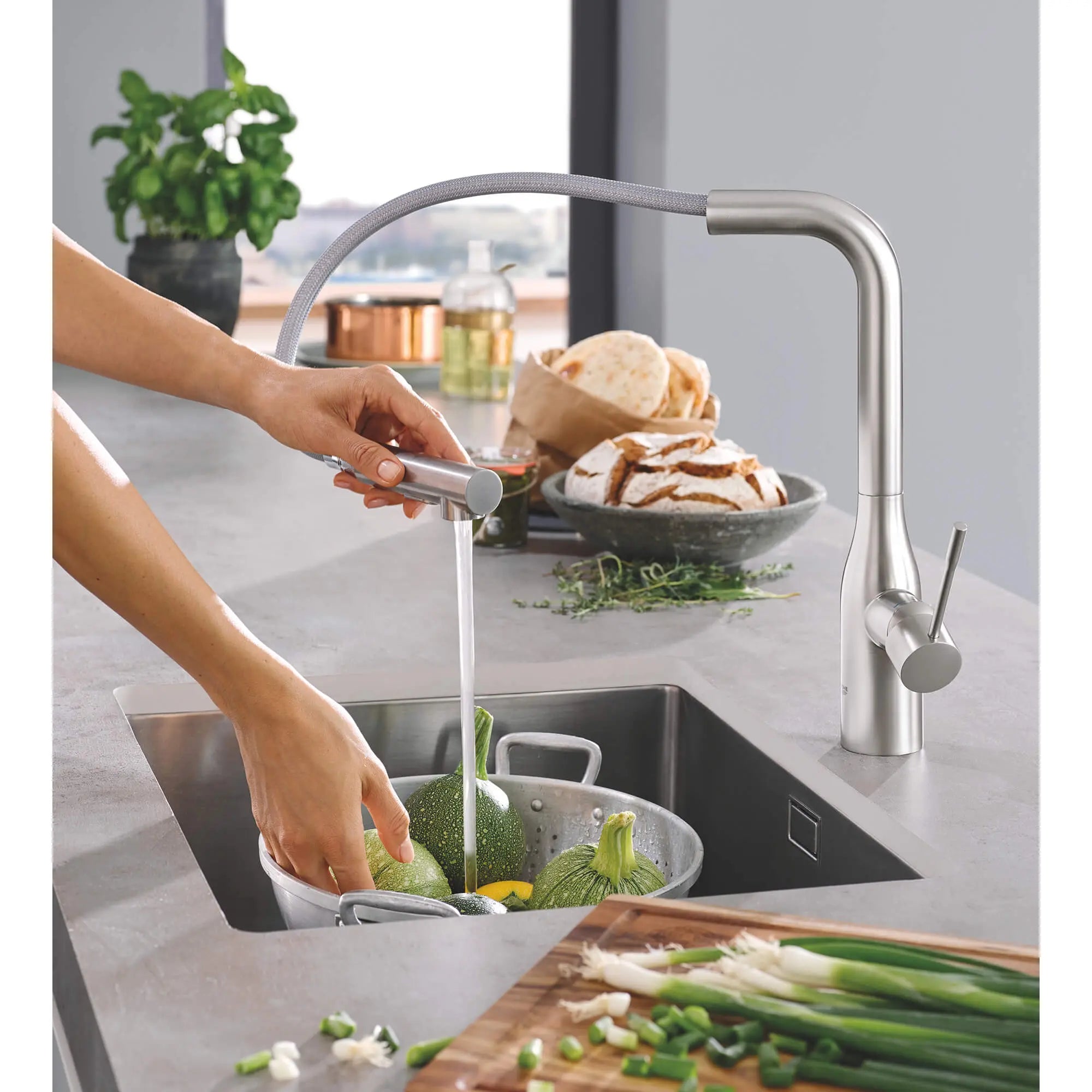 Essence Single-Handle Pull-Out Kitchen Faucet Dual Spray 1.75 GPM (6.6 L/min) // SUPERSTEEL INFINITYFINISH // 1493_30271dc0-single-handle-kitchen-faucet-enviro-3_0_CDNwebp.webp