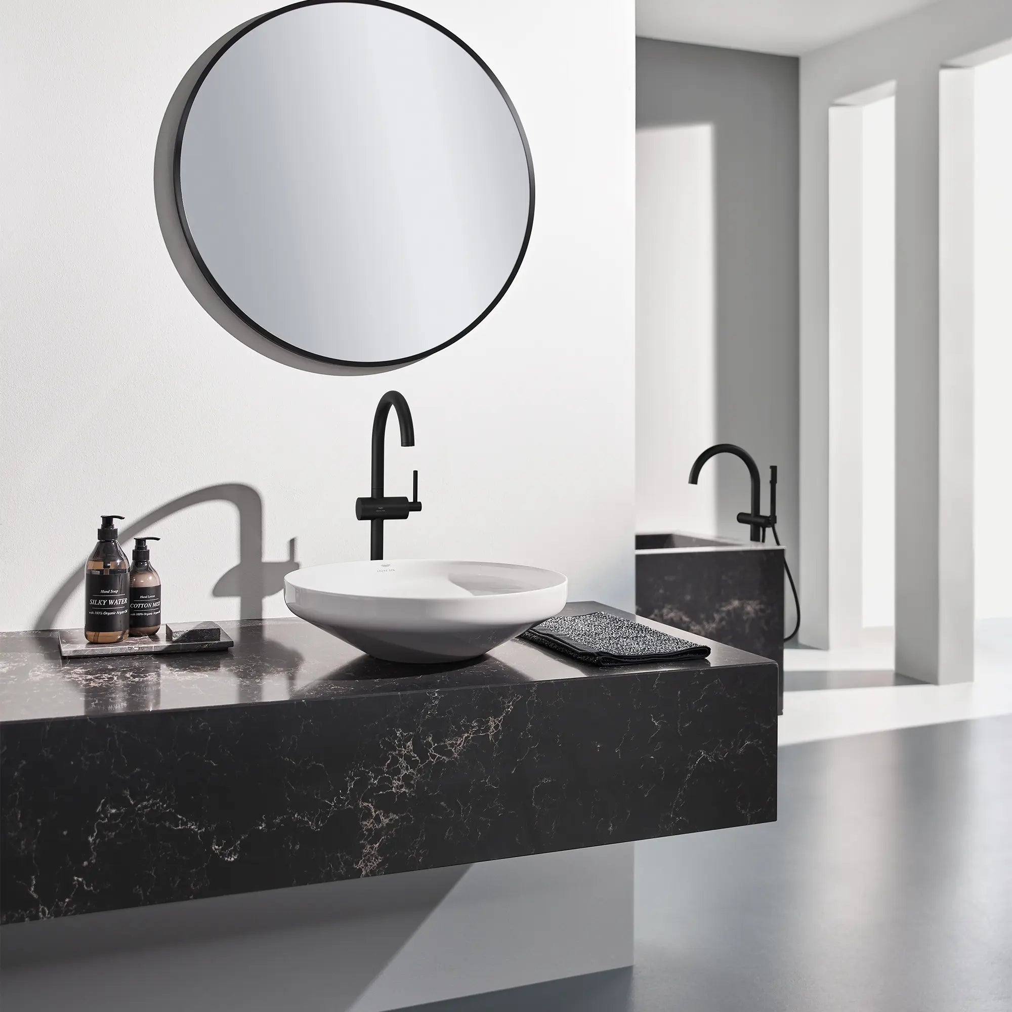 Atrio Single Hole Single-Handle L-Size Bathroom Faucet, 1.2 GPM (4.5 L/min) // MATTE BLACK // 244564_AtrioSPA_EnvironmentCloseUp_243502430_0002_APR2024_CDNwebp.webp