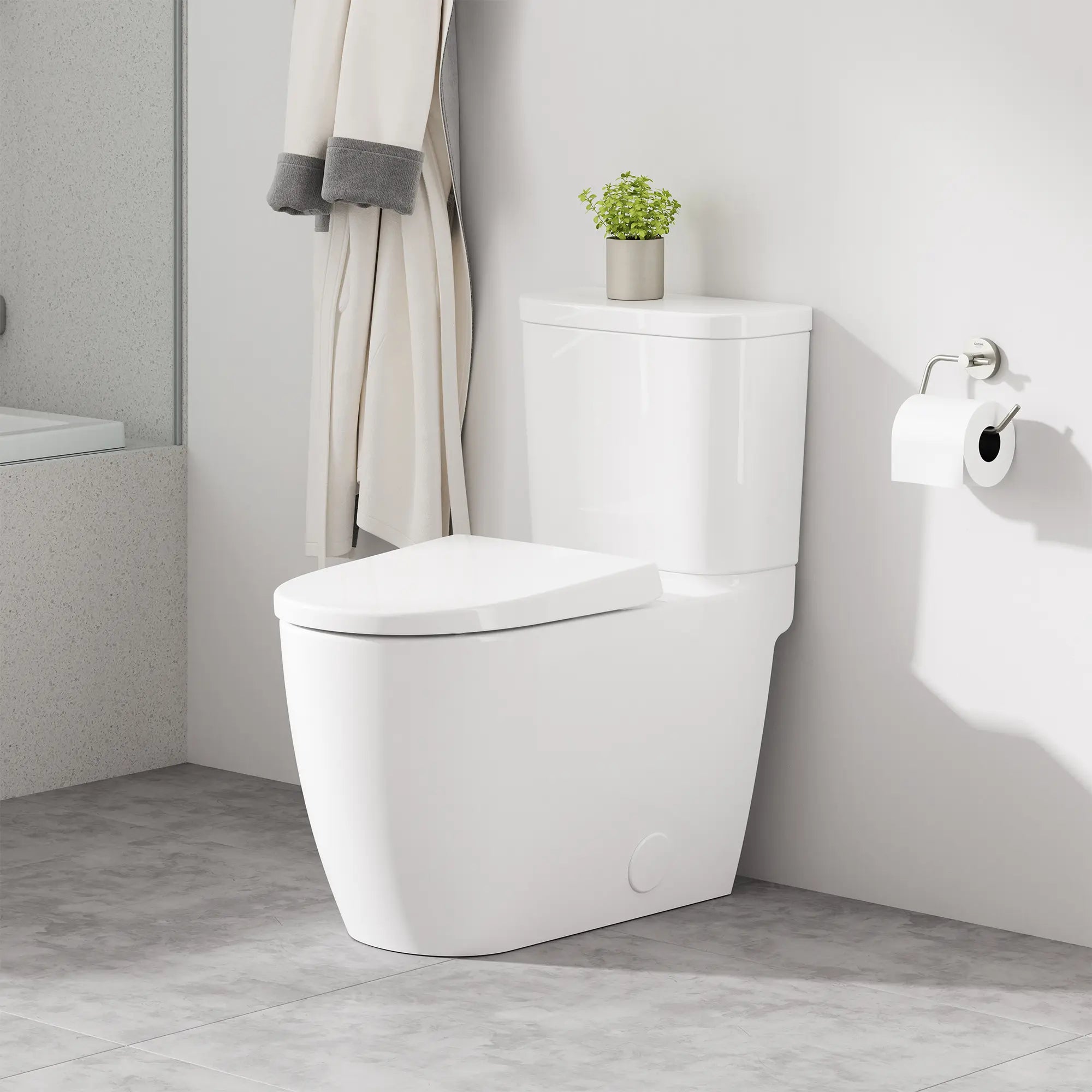 Two-piece Right height Elongated Toilet with seat, Left-Hand Trip Lever // LEFT / ALPINE WHITE // 253069_Cubeo_EnvironmentCloseUp_39675000_40689EN1_0001_OCTOBER2024_CDNwebp.webp