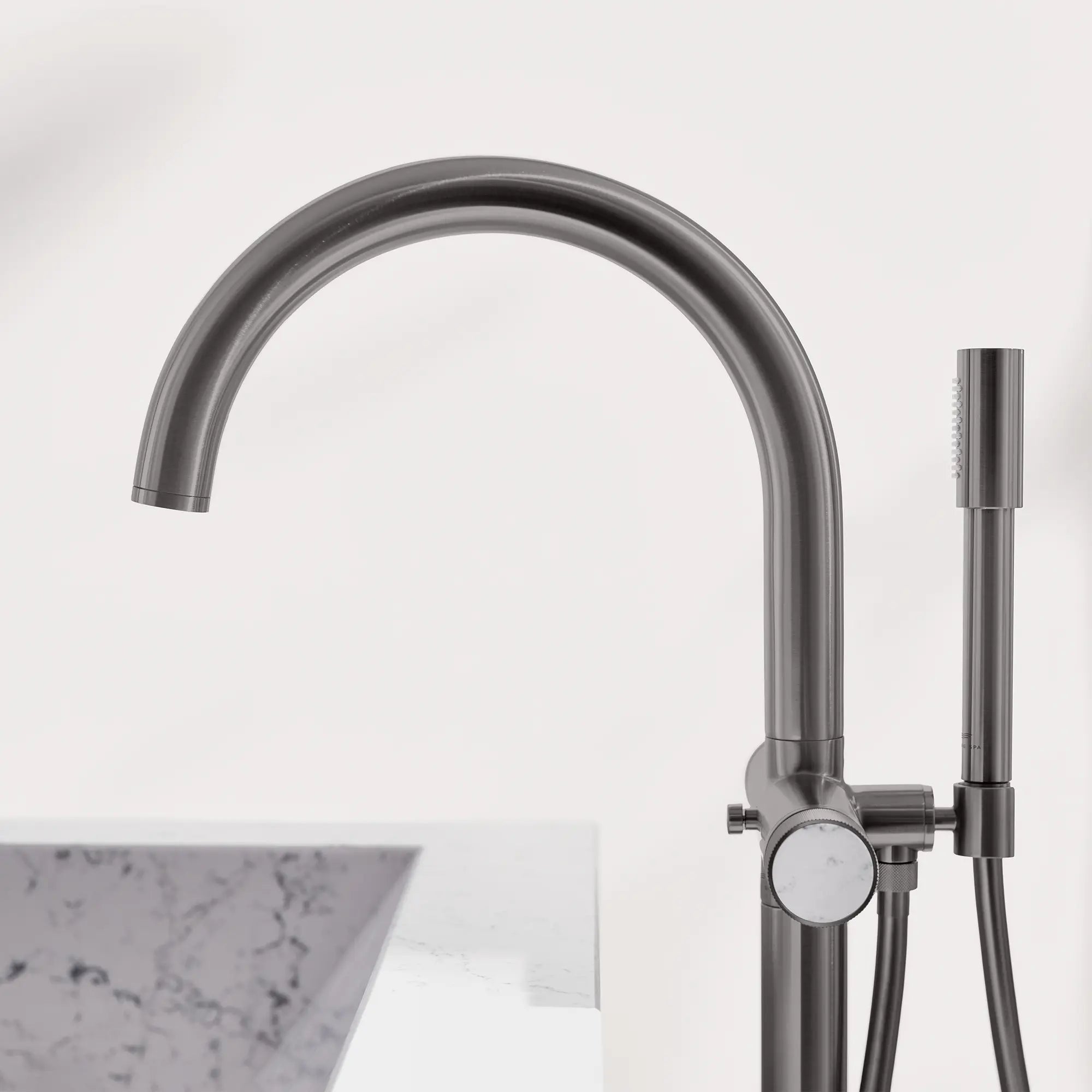 Atrio Private Collection 2-Handle Free Standing Tub Filler with Knob Handles, with 1.75 GPM Hand Shower // BRUSHED HARD GRAPHITE // 288571_Atrio_PC_EnvironmentCloseUp_105772AL00_0001_April2026_0_CDNwebp.webp