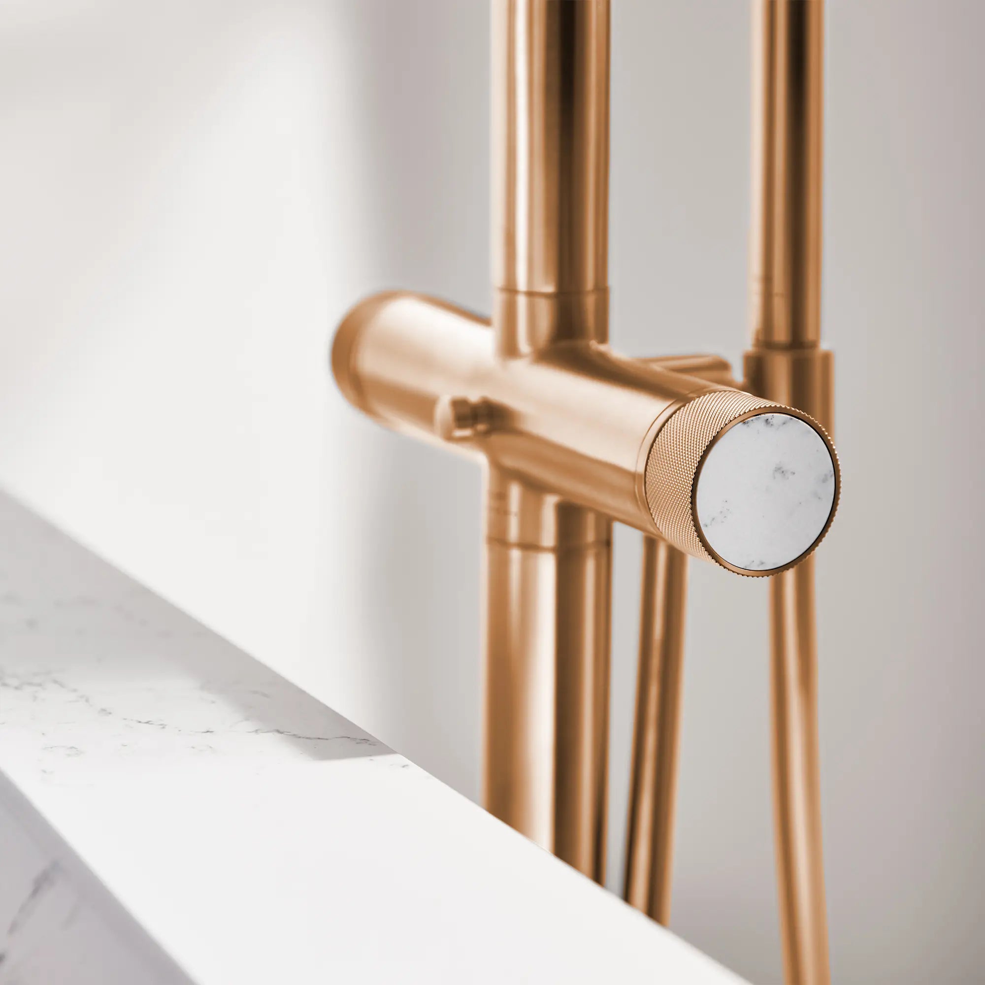 Atrio Private Collection 2-Handle Free Standing Tub Filler with Knob Handles, with 1.75 GPM Hand Shower // BRUSHED WARM SUNSET // 288572_Atrio_PC_EnvironmentCloseUp_105772DL00_0002_April2026_0_CDNwebp.webp
