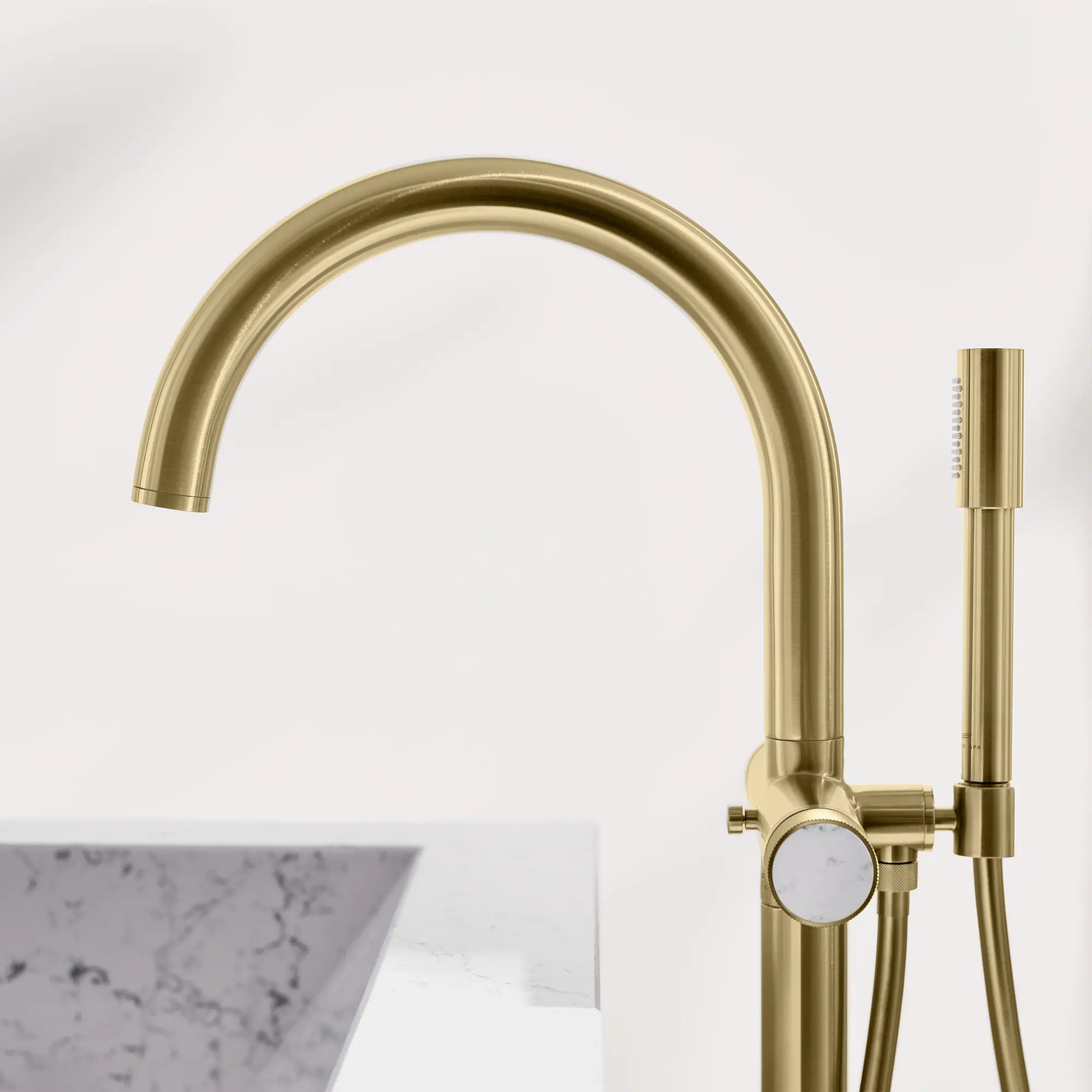 Atrio Private Collection 2-Handle Free Standing Tub Filler with Knob Handles, with 1.75 GPM Hand Shower // BRUSHED COOL SUNRISE // 288576_Atrio_PC_EnvironmentCloseUp_105772GN0_0001_April2026_0_CDNwebp.webp